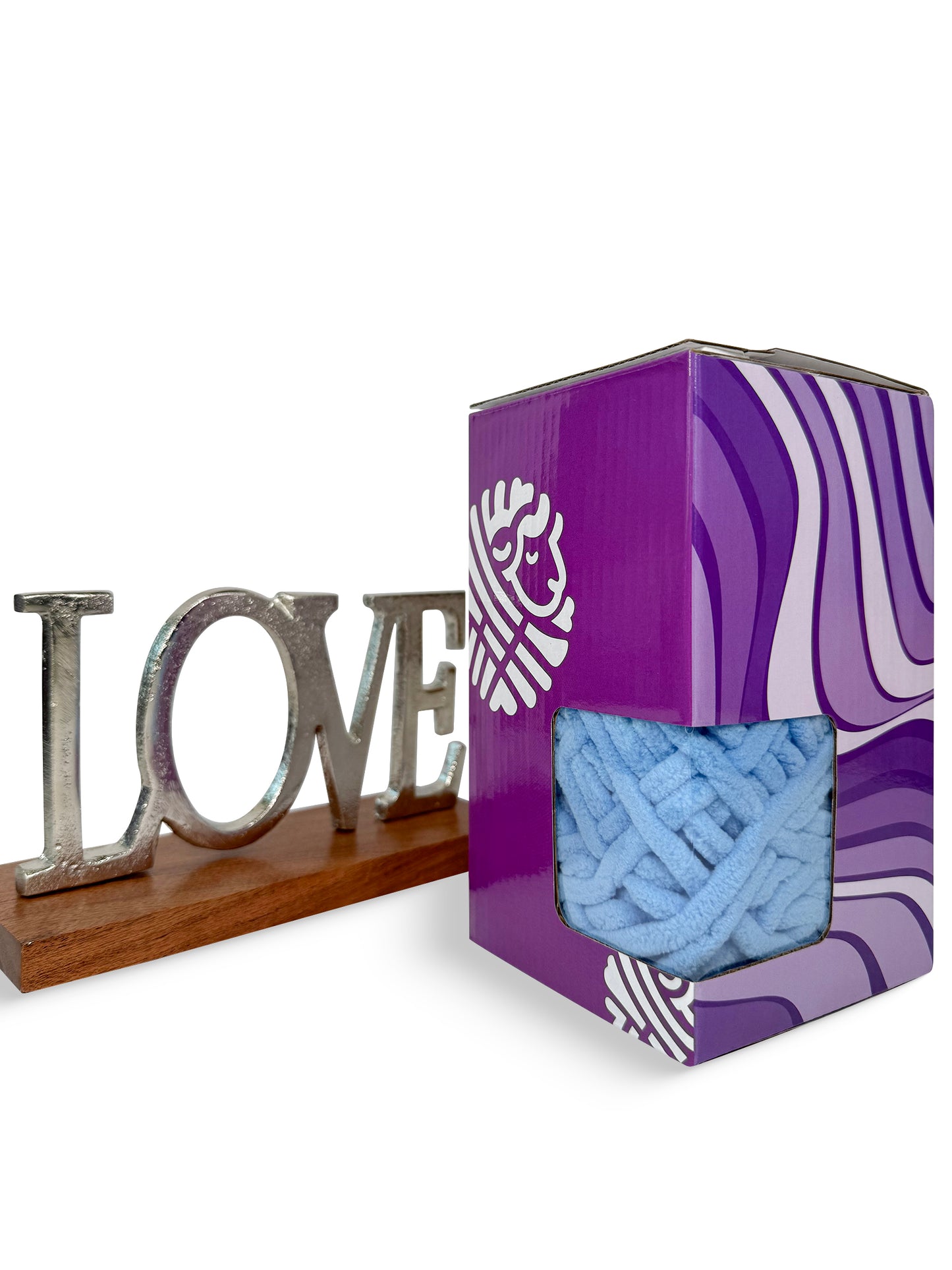 Ice Blue Tenderness, a tender ice blue super bulky chenille yarn skeins neatly arranged inside a box, perfect for large crochet and knitting projects